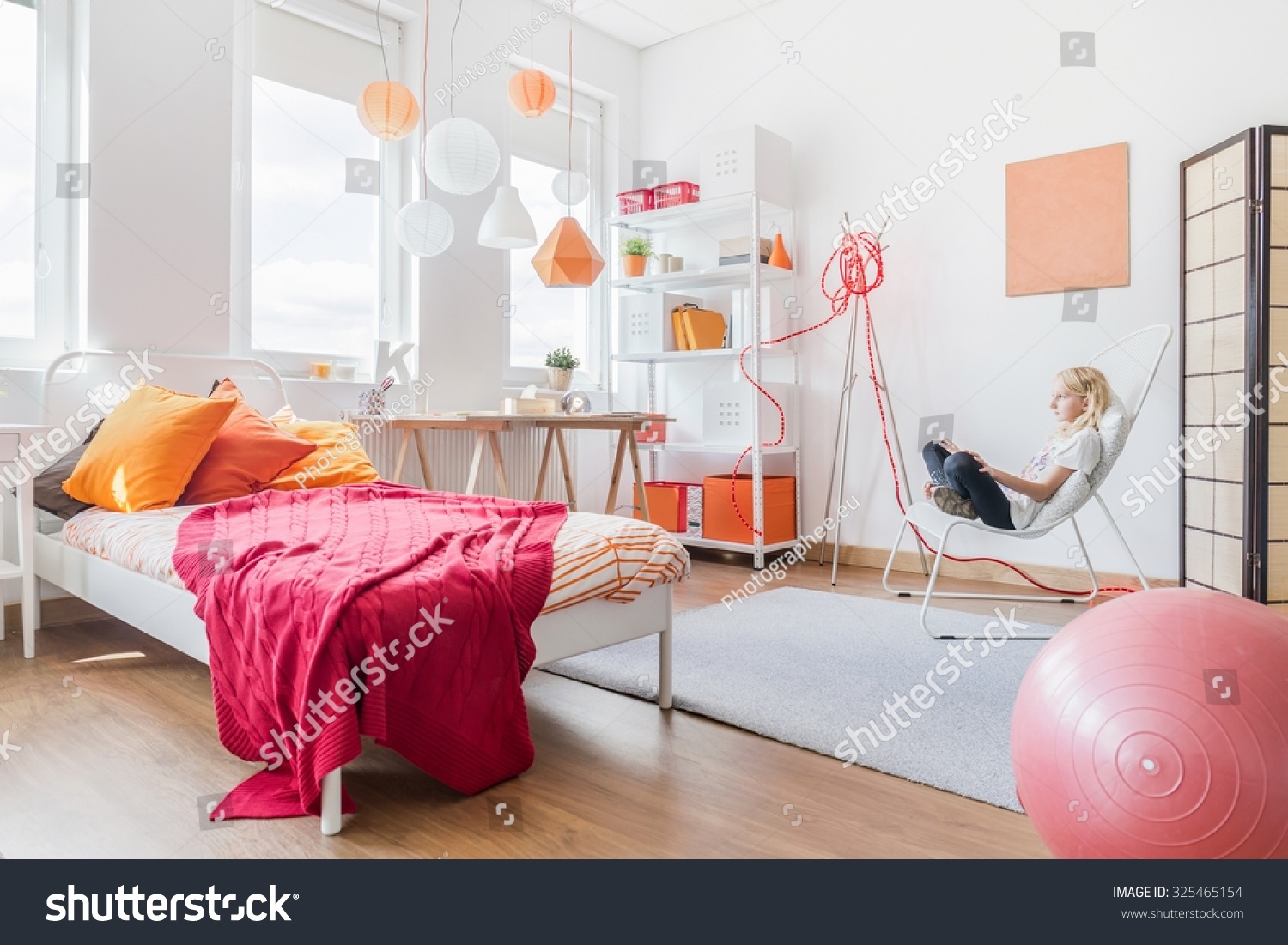 Blonde teen girl relaxing in her bedroom Blonde teen girl relaxing in her bedroom