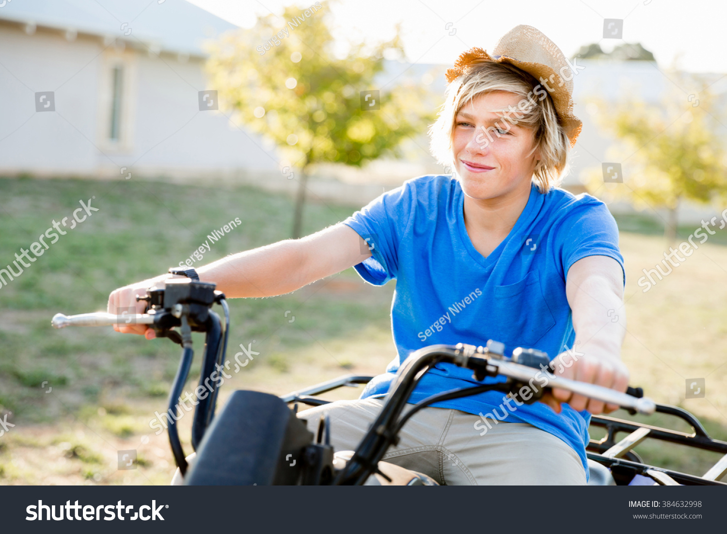 Boy riding farm truck in vineyard Boy riding farm truck in vineyard