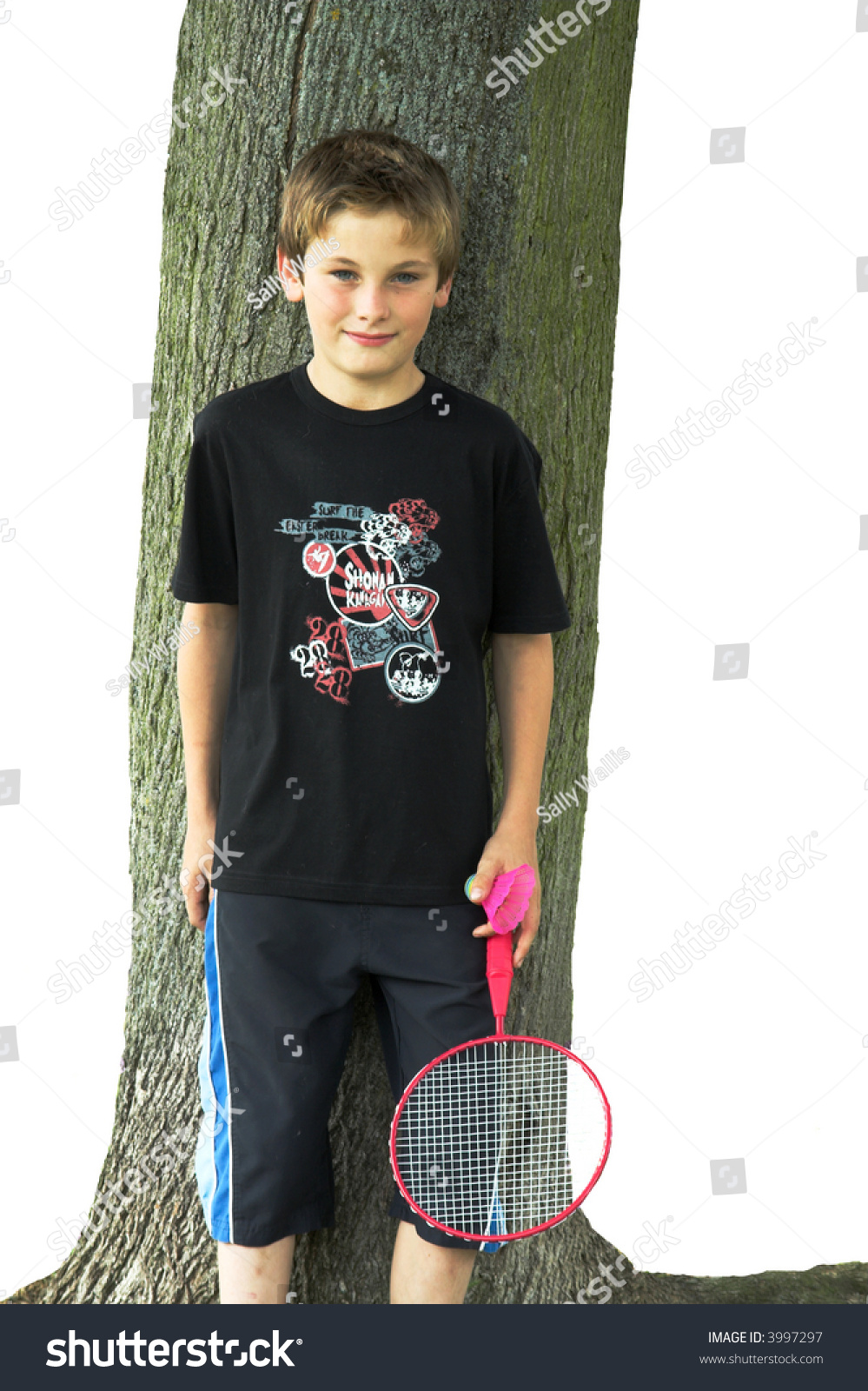 stock-photo-boy-with-racquet-and-shuttle-cock-standing-against-tree-3997297.jpg