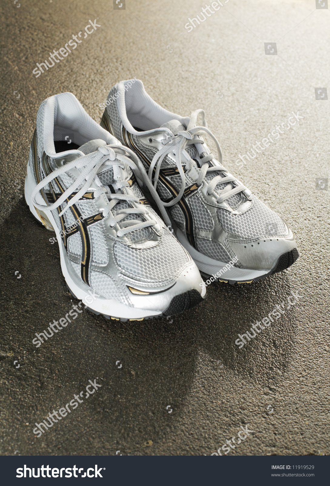 Brand New Running Shoes On Wet Concrete Stock Photo 11919529 Shutterstock