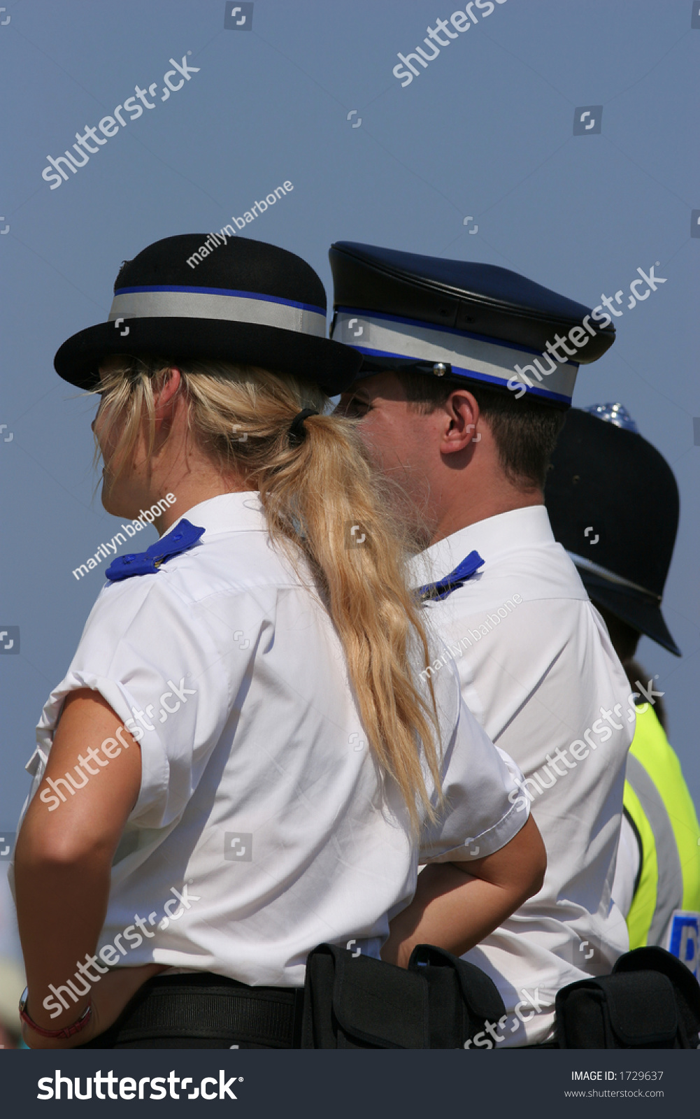 British Police In Uniform With A Blonde Female