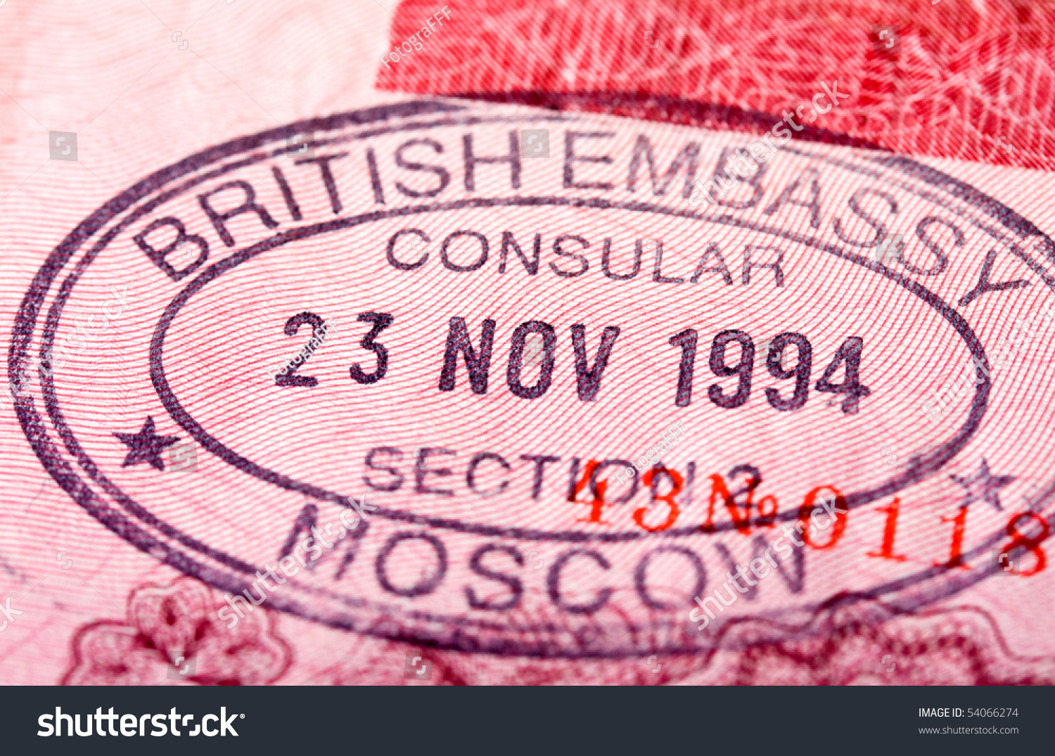 British Visa Entry And Exit Stamp In Passport Stock Photo