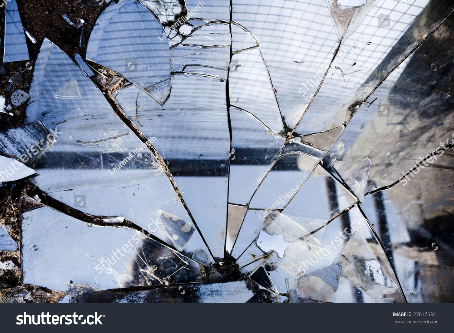 Broken mirrors make a beautiful reflection in the sun left in the desert amongst trash and found pieces of art and garbage Broken mirrors make a beautiful reflection in the sun left in the desert amongst trash and found pieces of art and garbage