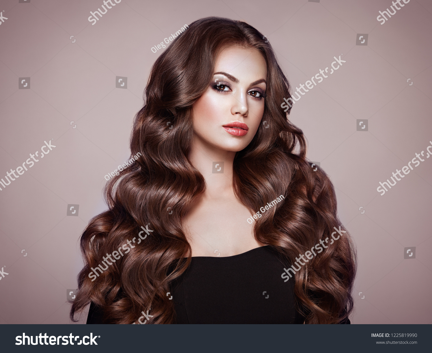 Стоковая фотография 1225819990 Brunette Girl Long Healthy Shiny Curly