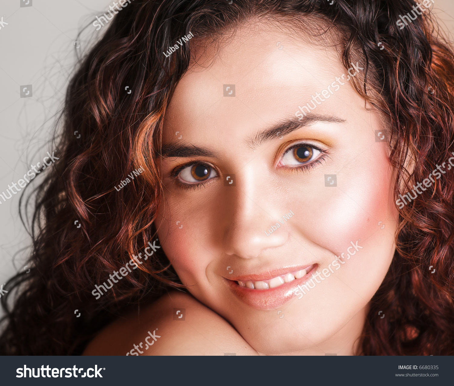 Brunette Teenage Girl With Loose Curly Hair Laughin