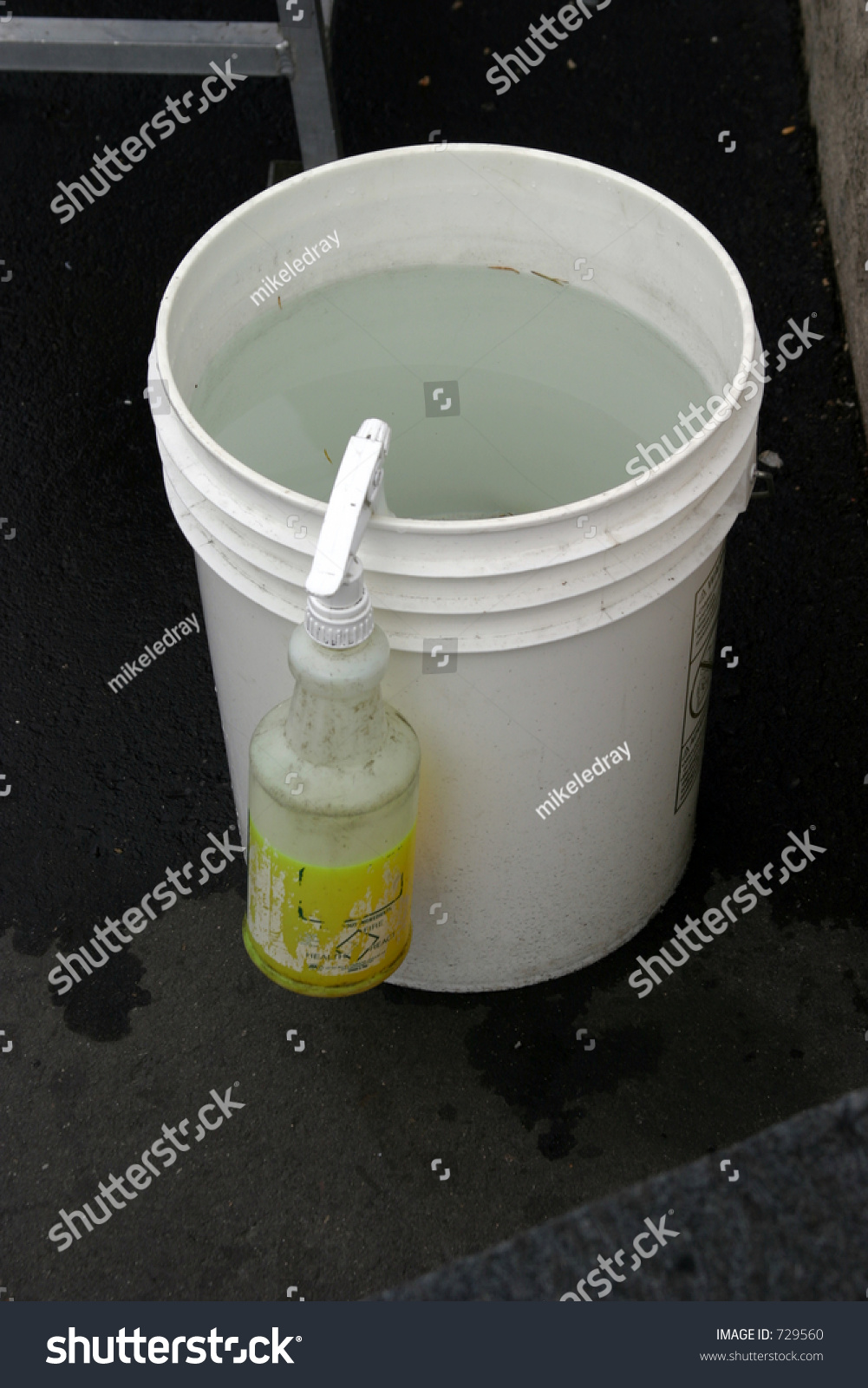 Bucket Of Water With Squirt Bottl