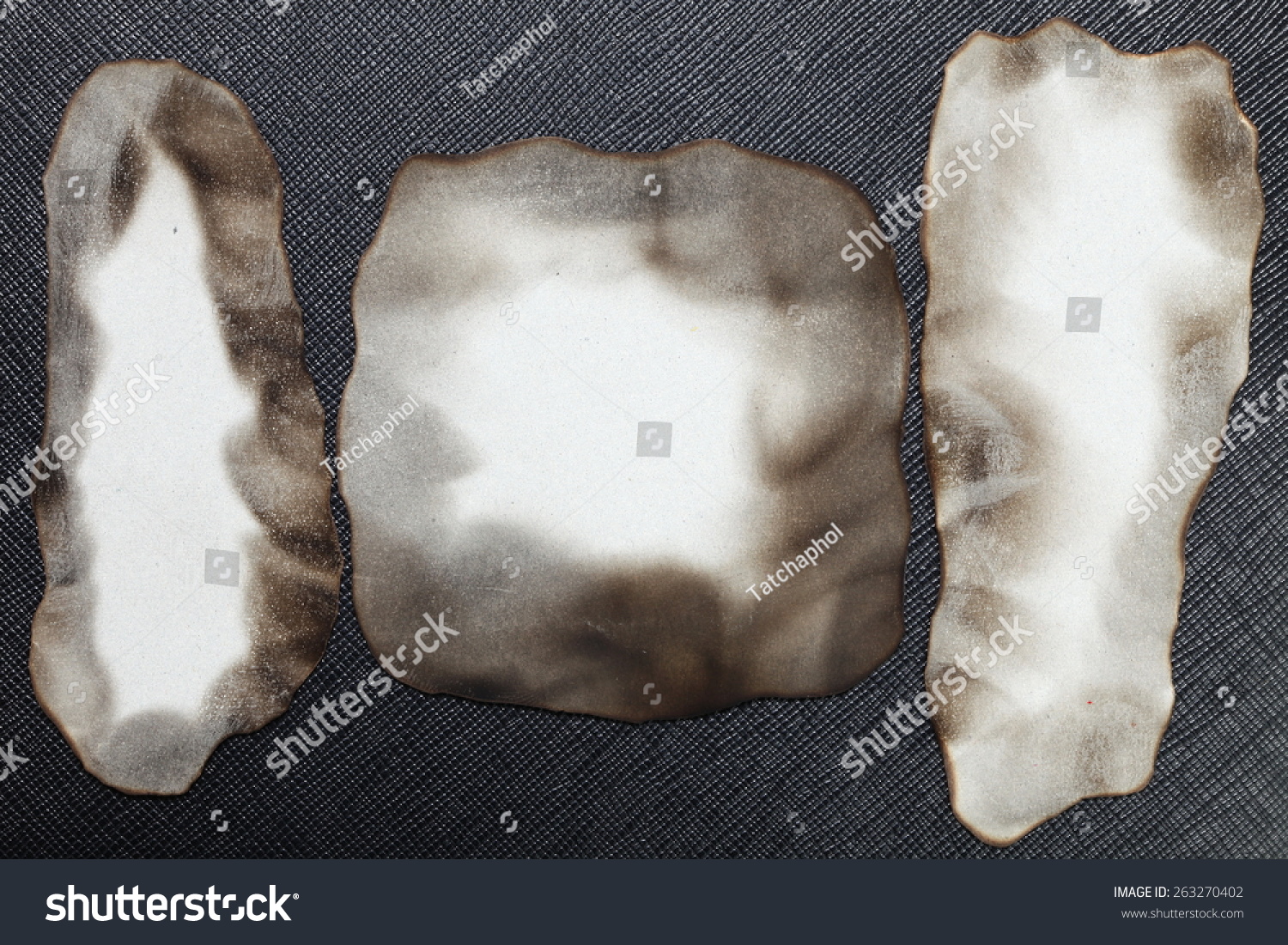 Burned paper put on the black color leather background represent the retro style and vintage paper concept related idea Burned paper put on the black color leather background represent the retro style and vintage paper concept related idea