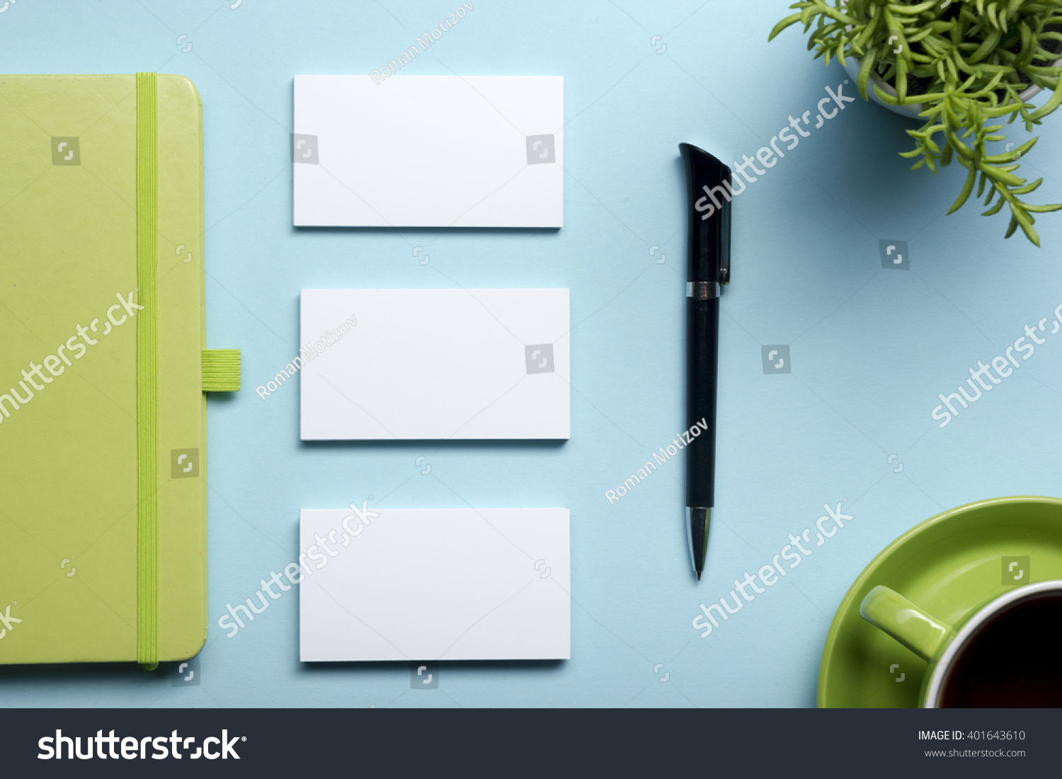 Business card blank notepad flower coffee cup and pen at office desk table top view Corporate stationery branding mock-up Business card blank notepad flower coffee cup and pen at office desk table top view Corporate stationery branding mock-up