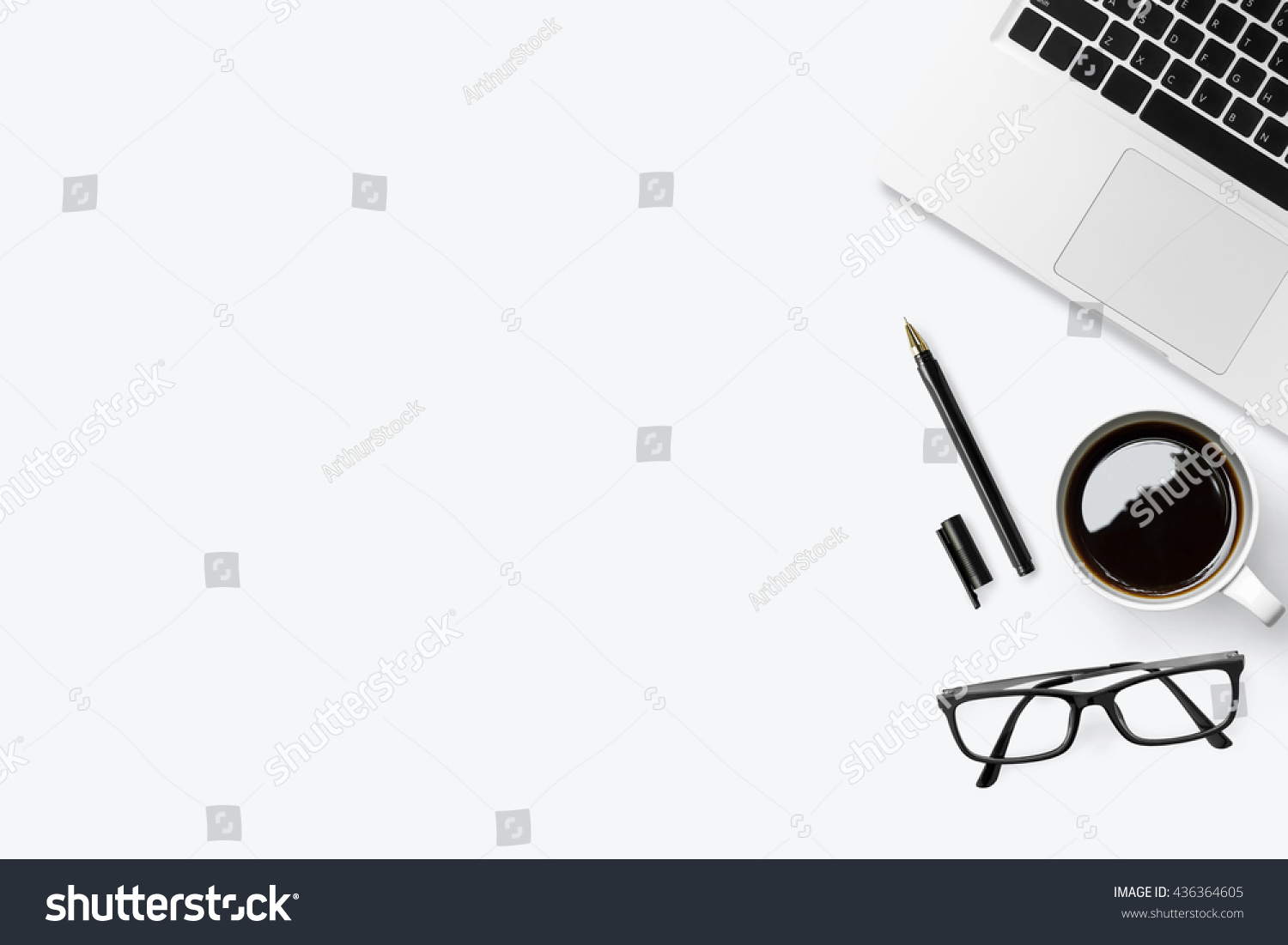 Business desk table with laptop coffee pen and eye glasses on top of it Top view with copy space flat lay Business desk table with laptop coffee pen and eye glasses on top of it Top view with copy space flat lay