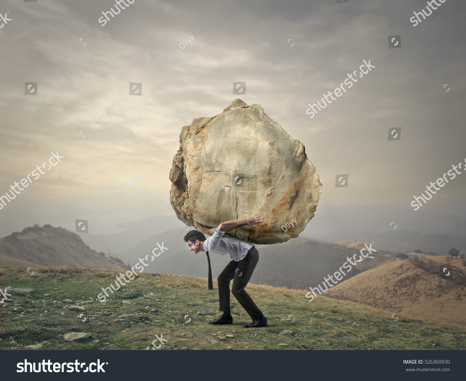 Businessman Carrying A Big Rock Stock Photo Shutterstock