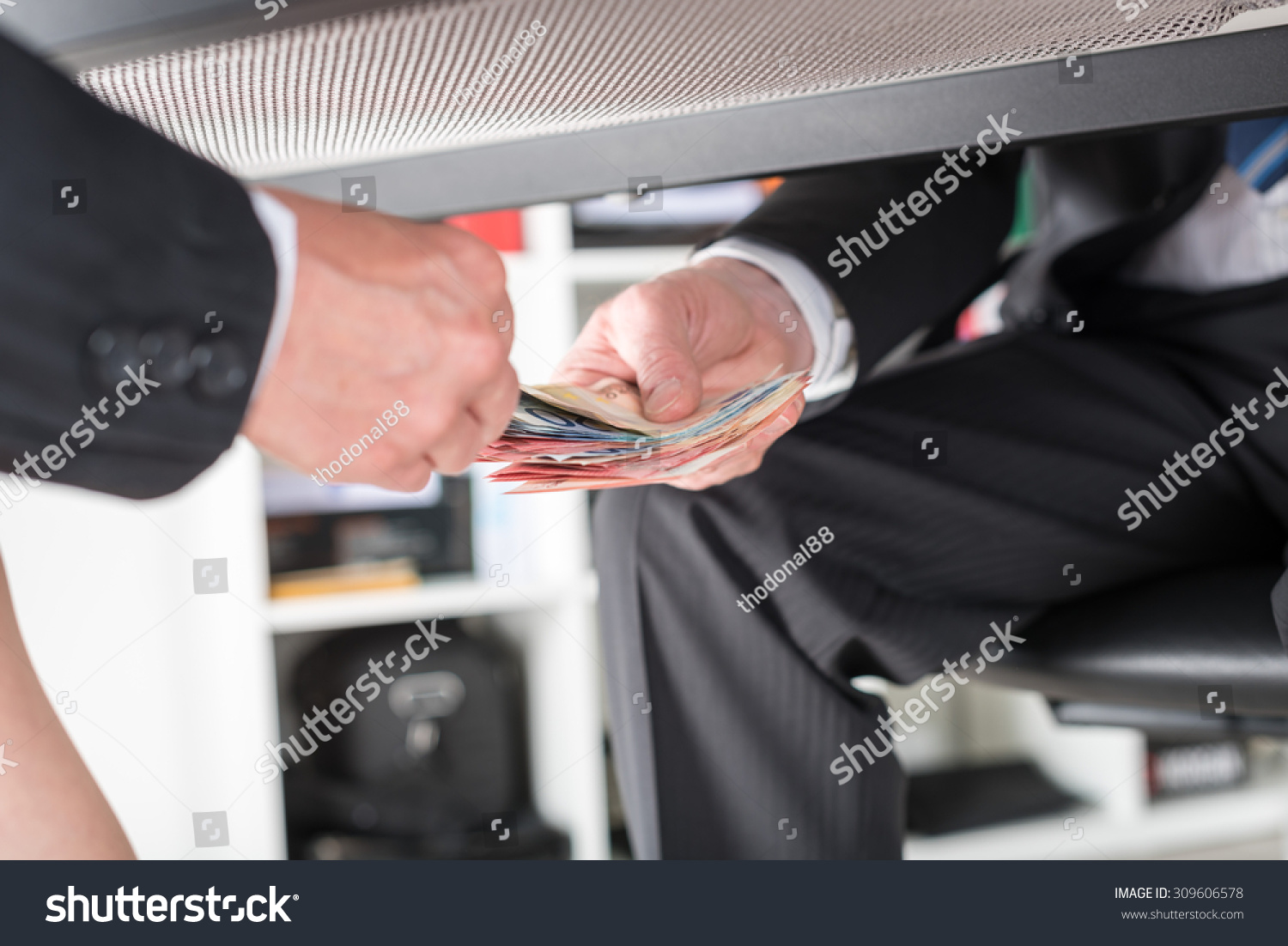 Businessman Giving Money Under Table Stock Photo 309606578 - Shutterstock