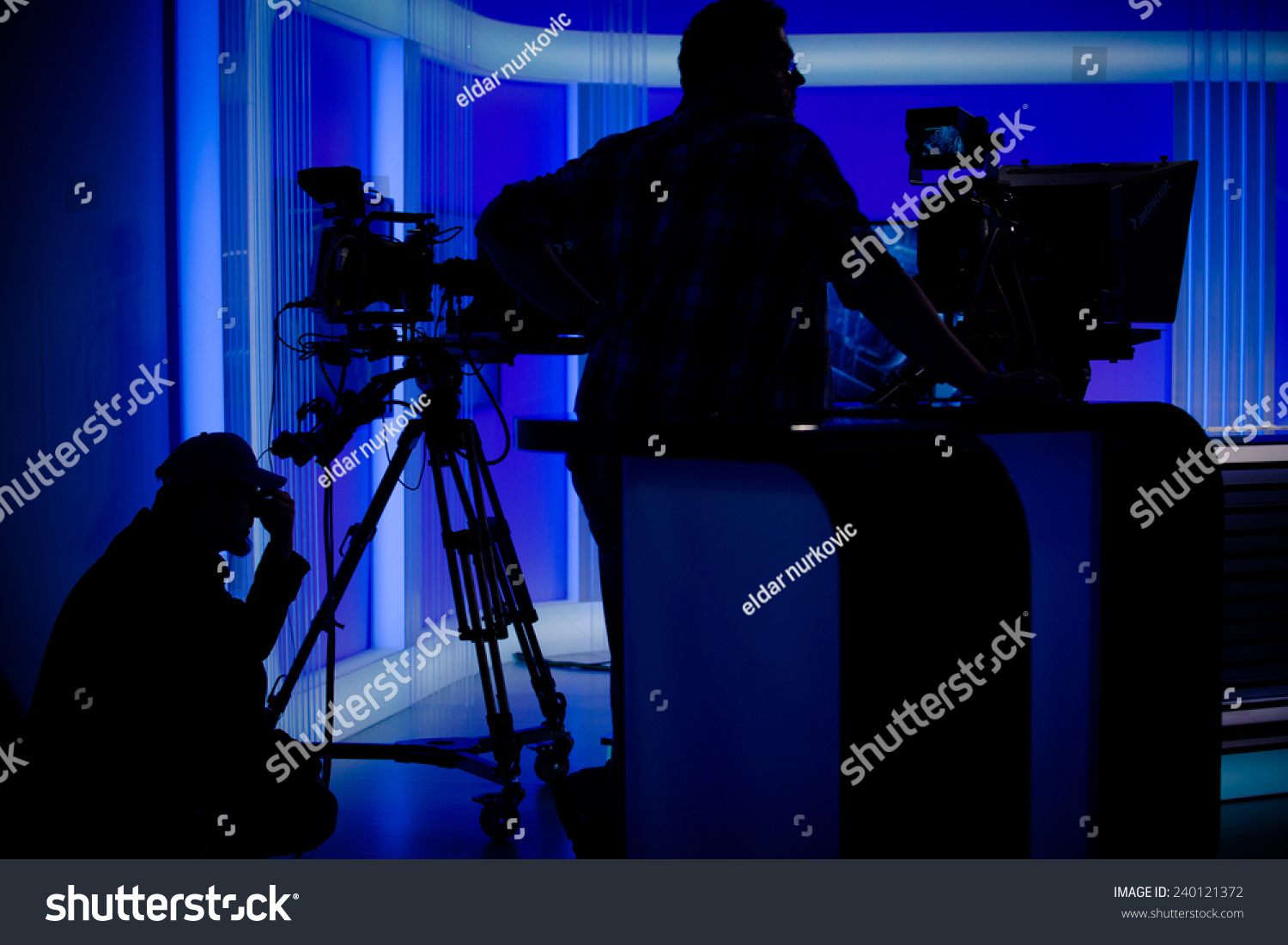 Cameraman Silhouettes On A Live Studio News Stageprofessional