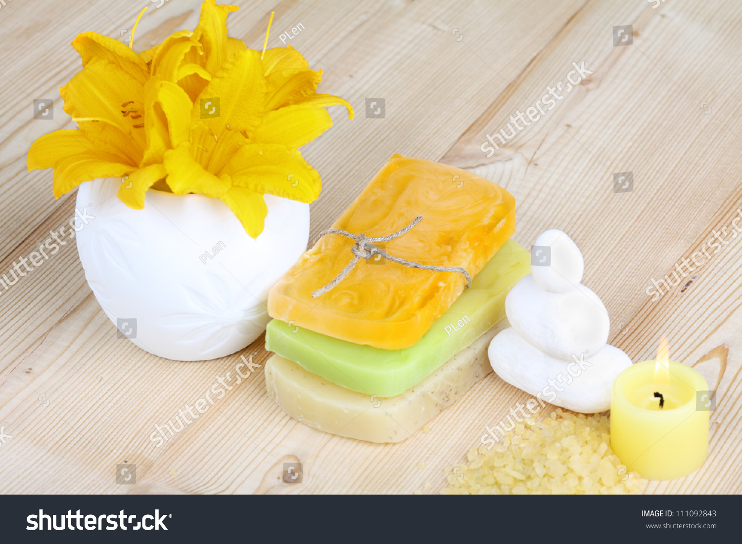 Candle, Stones And Handmade Soap On A Wooden Background Stock Photo ...