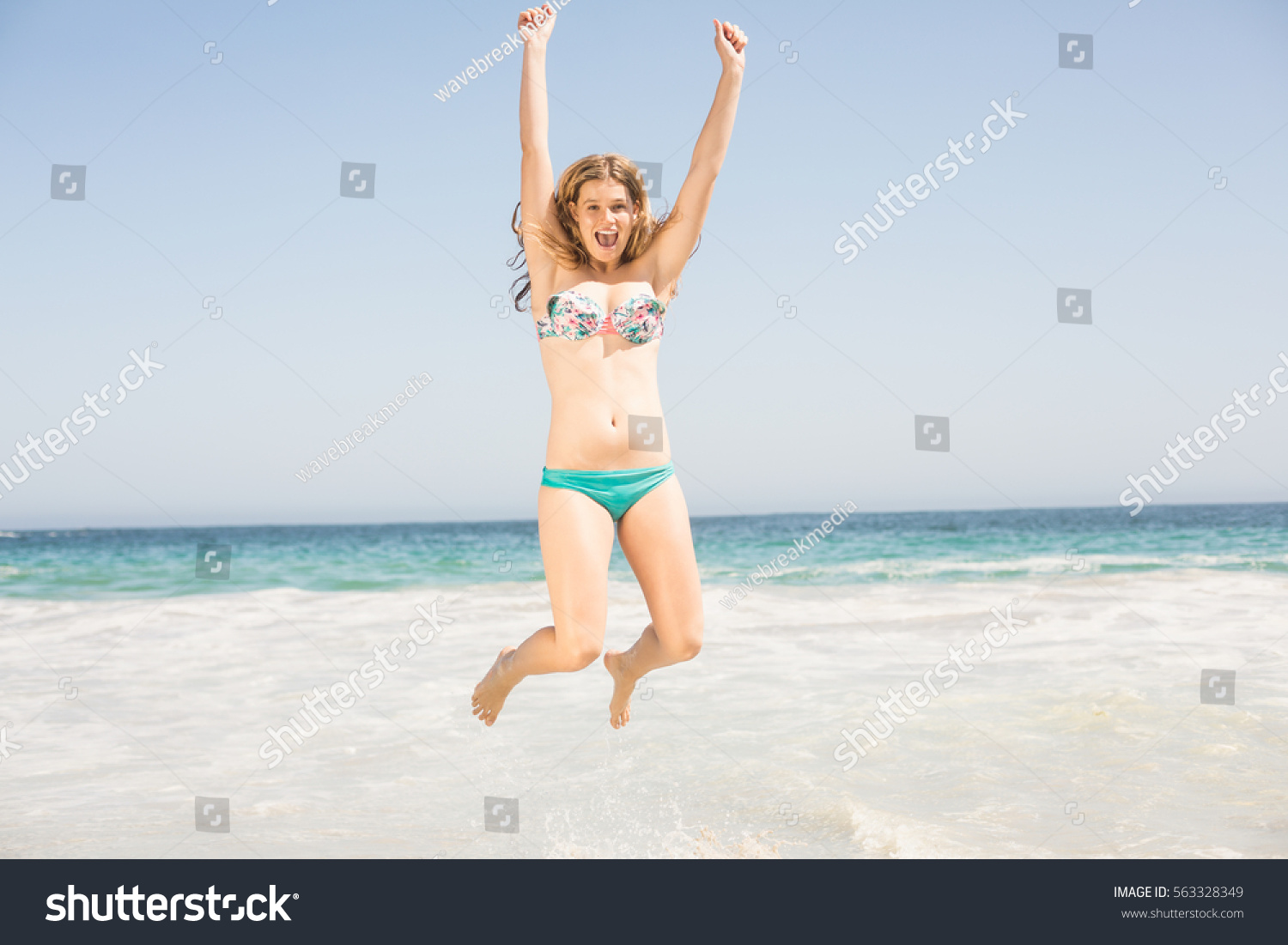 Carefree Woman Bikini Jumping On Beach Stock Photo Edit Now