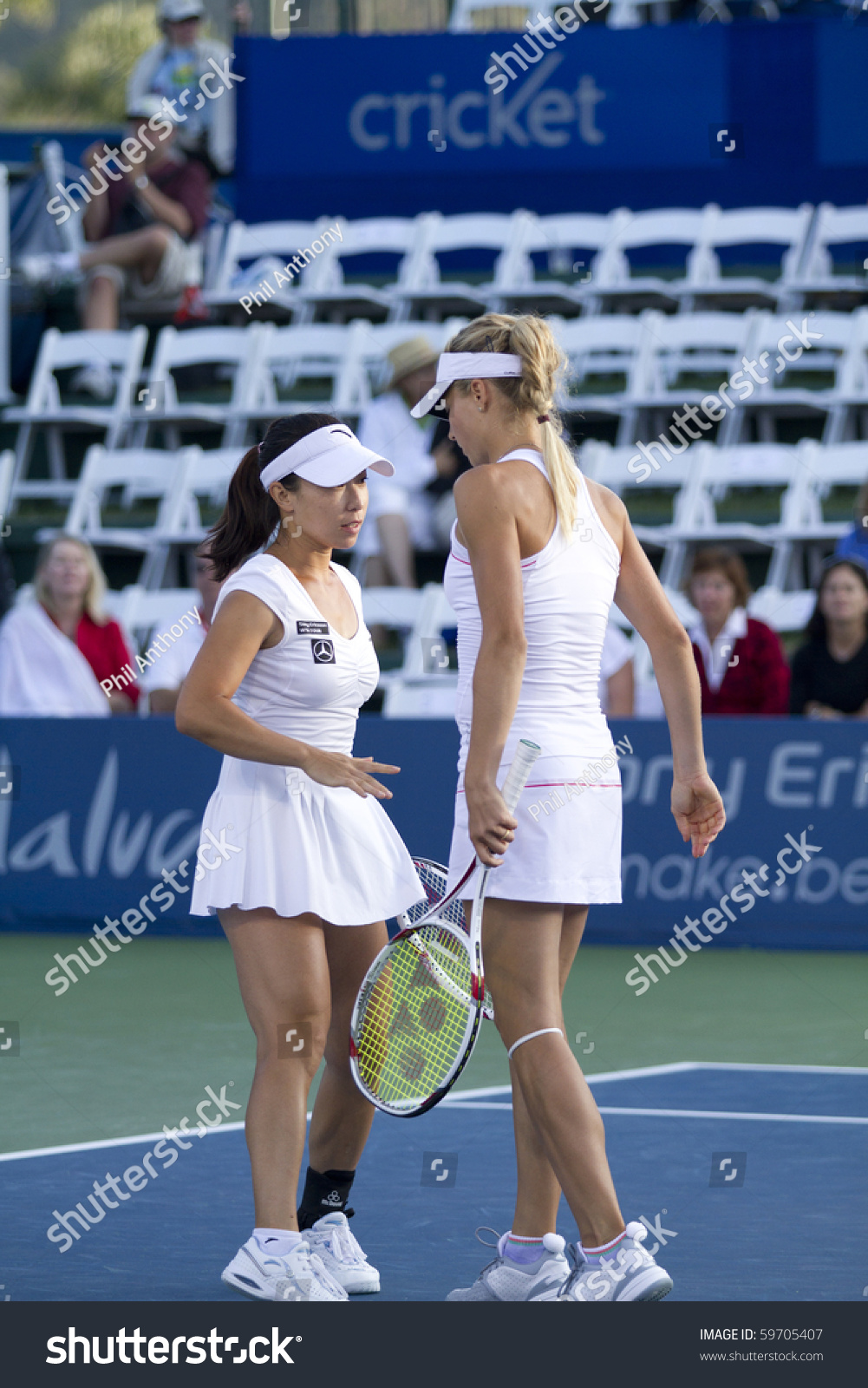 CARLSBAD CA AUGUST 08 Jie Jheng and Maria Kirilenko discuss strategy in their doubles final victory at the Mercury Insurance Open at La Costa Resort and Spa in Carlsbad CA on August 8 2010 CARLSBAD CA AUGUST 08 Jie Jheng and Maria Kirilenko discuss strategy in their doubles final victory at the Mercury Insurance Open at La Costa Resort and Spa in Carlsbad CA on August 8 2010