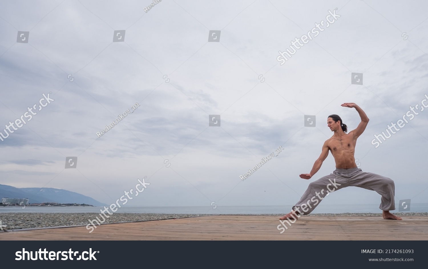 Caucasian Man Naked Torso Practicing Wushu Stock Photo