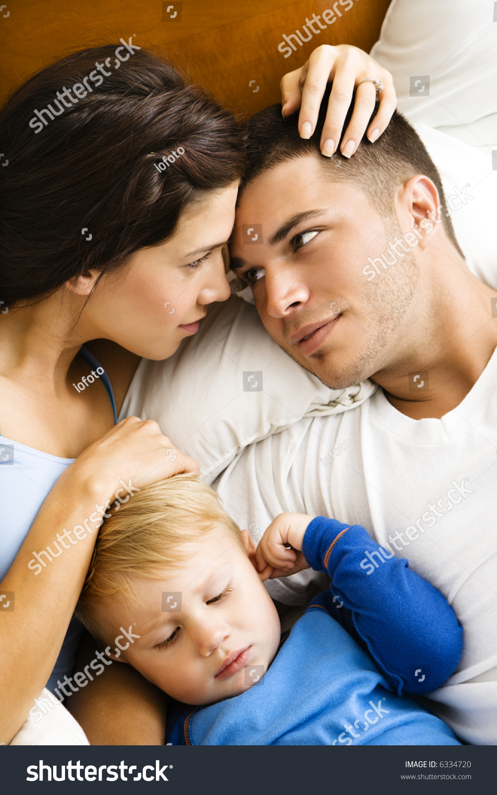 Caucasian Parents Cuddling Toddler Son Sleeping Stock Photo 6334720 