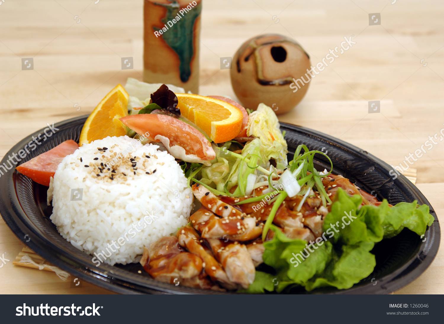 Chicken Teriyaki Plate With Chicken Teriyaki Asian Soy Ginger Salad Steamed Rice And Oranges