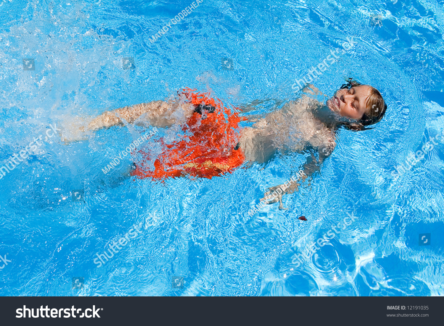 kid floating in pool