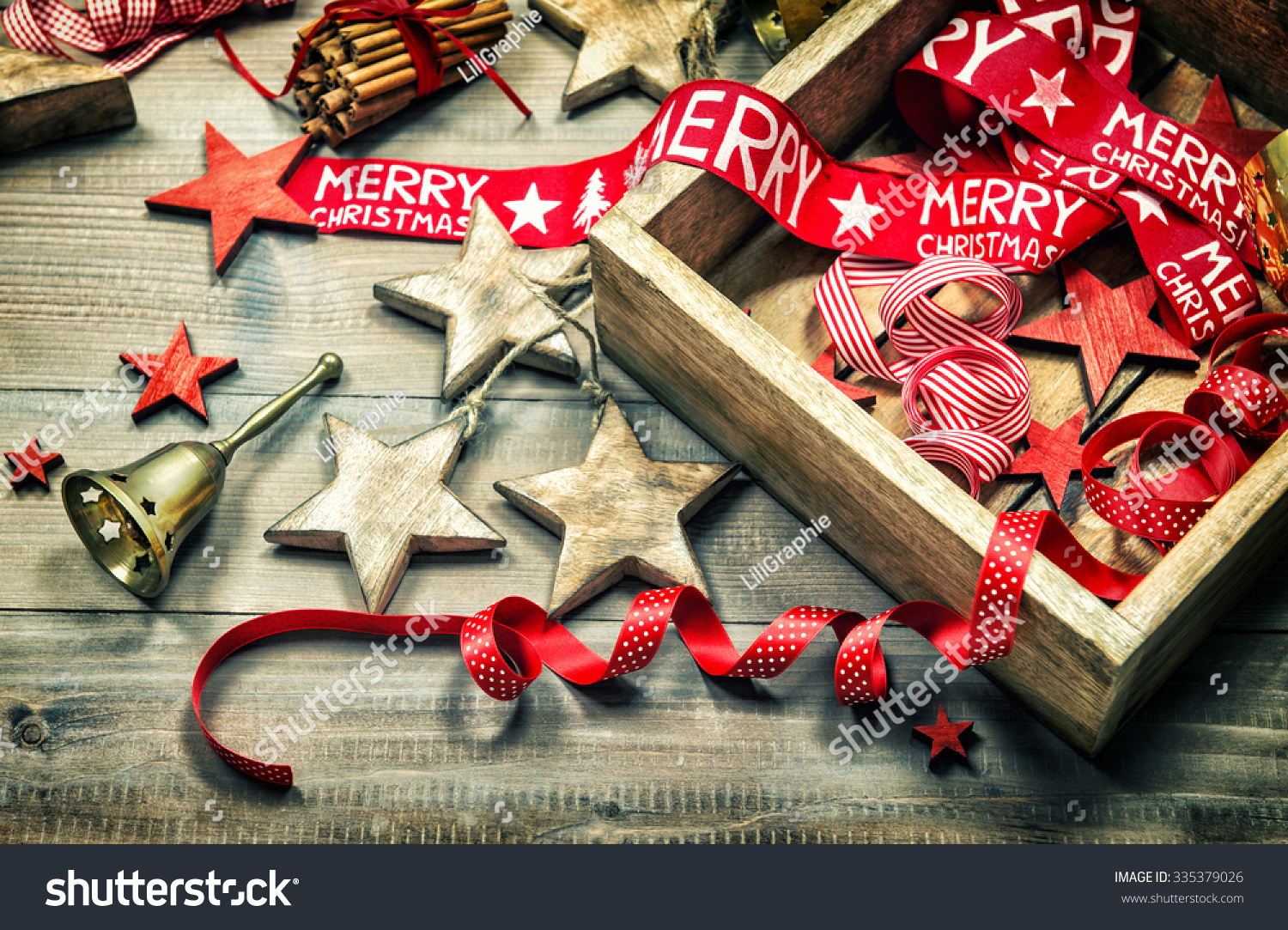 Christmas decoration and ornaments on rustic wooden background Retro style dark colored picture with vignette Christmas decoration and ornaments on rustic wooden background Retro style dark colored picture with vignette