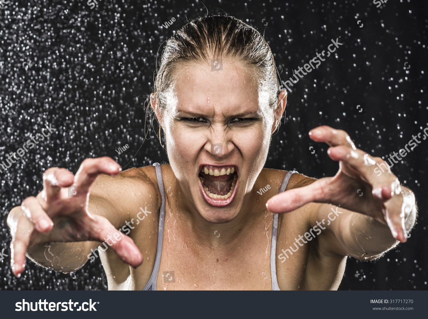 Close Up Angry Female Fighter Reaching Her Hands Towards The Camera