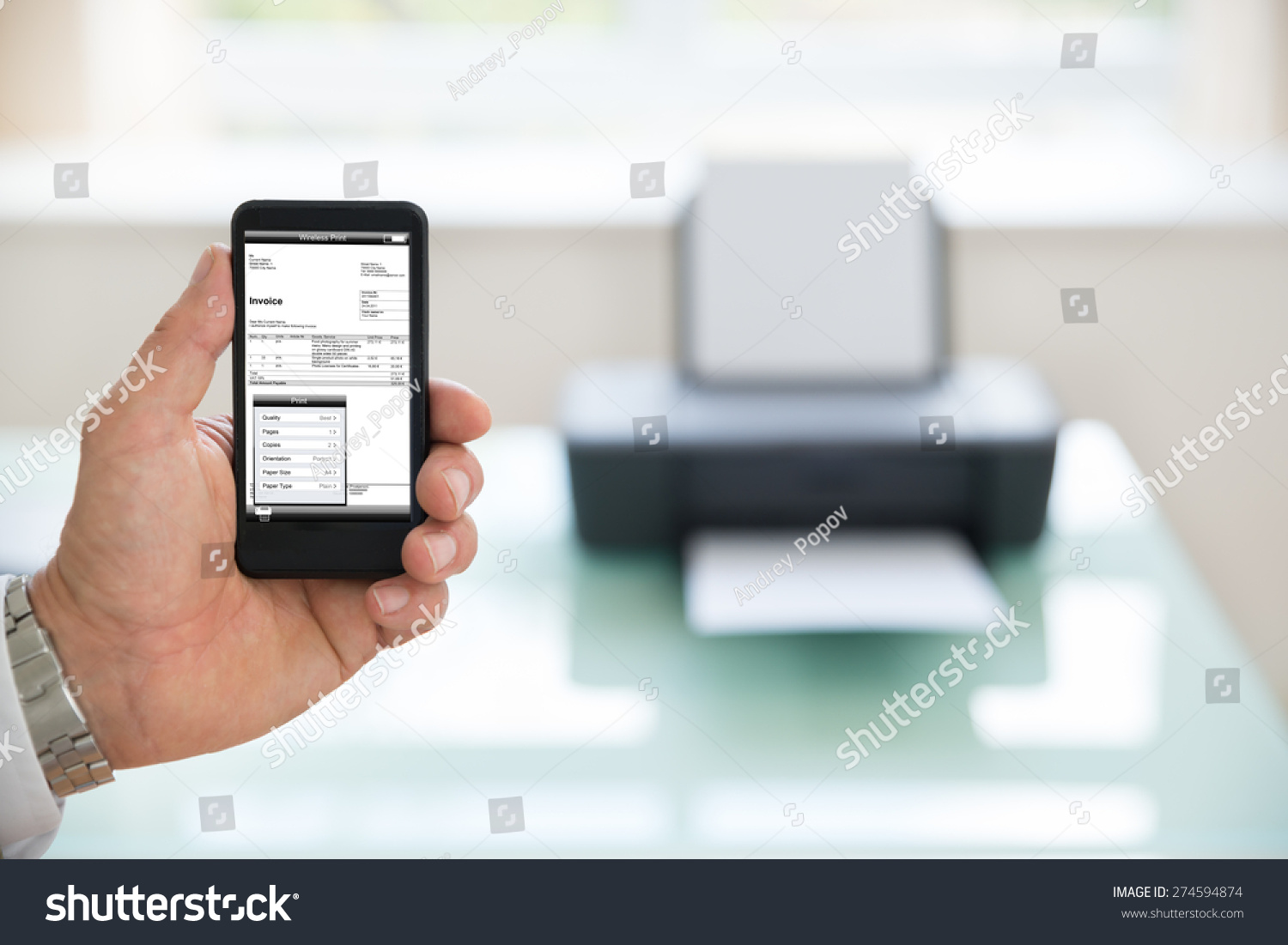 Close-up Of A Businessman Using Cellphone For Printing Invoice Photographer owns copyright for images on screen Close-up Of A Businessman Using Cellphone For Printing Invoice Photographer owns copyright for images on screen