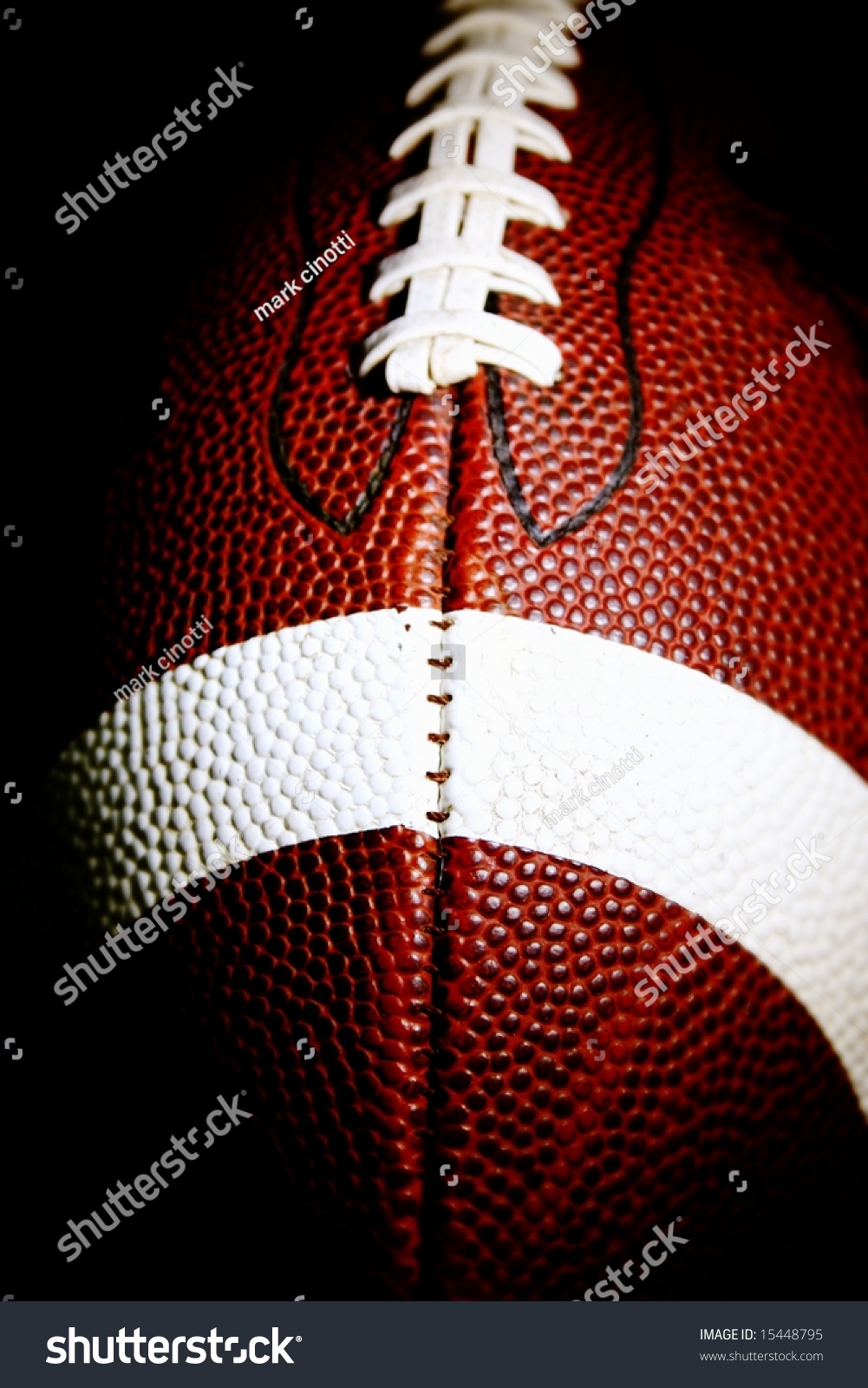 Close American Football Against Black Background Stock Photo 15448795