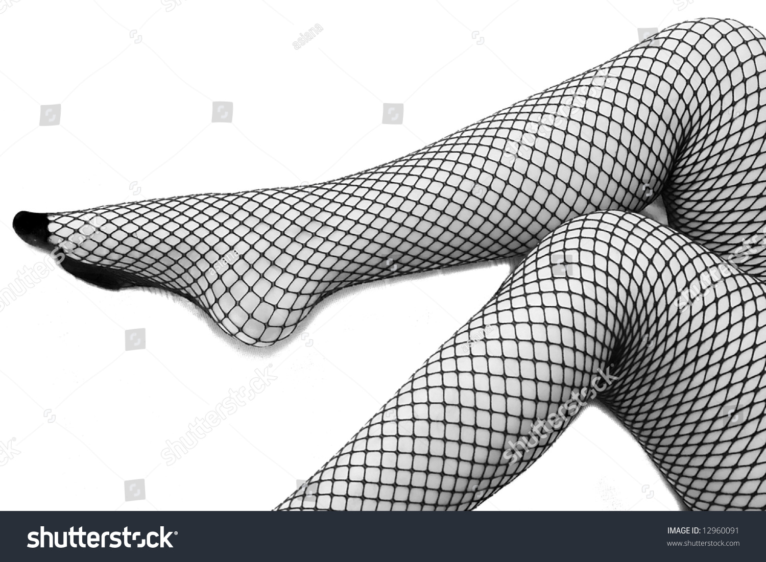 Close Up Of Caucasian Woman In Fishnet Stockings Sexy Female Legs Wearing Lingerie On White