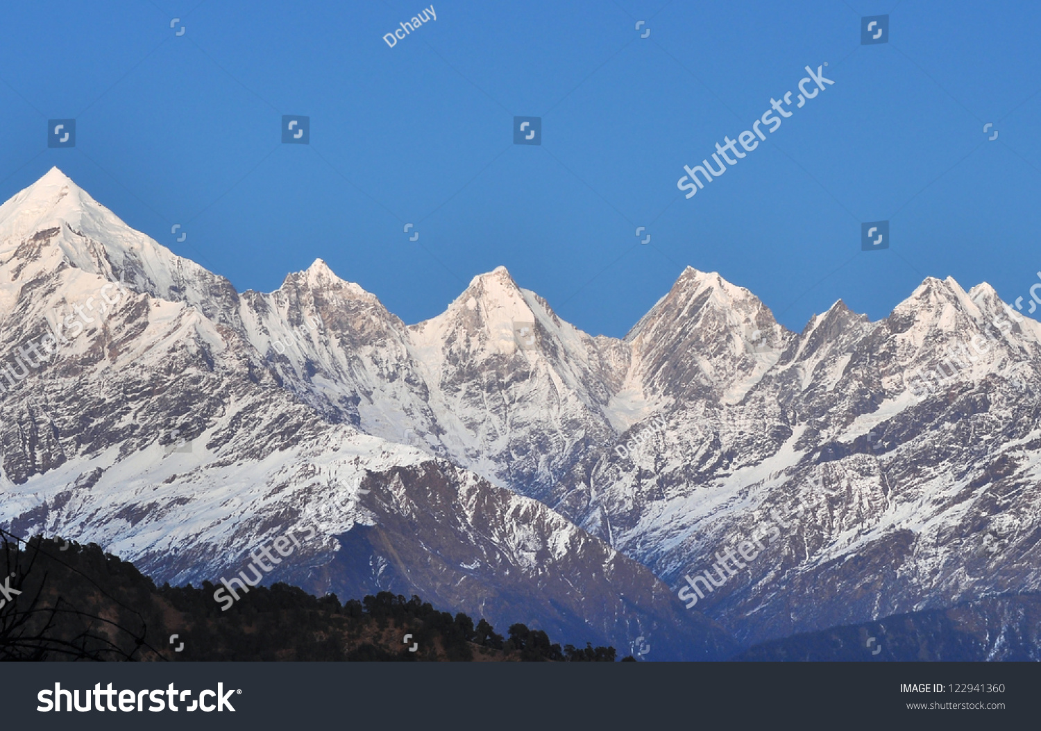 Close Up Of Chain Of Five Snow Clad Mountain Peaks In Himalaya Stock 