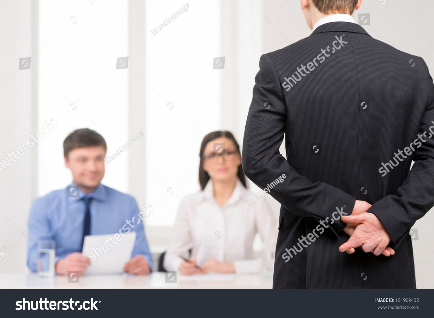 close man back fingers crossed behind stock photo