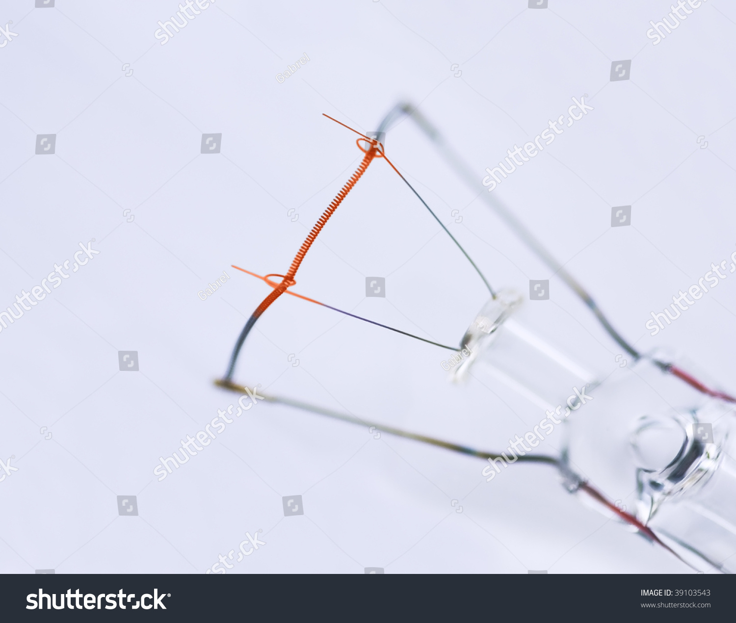 Close Up Of Tungsten Wire Of A Common Light Bulb. Wire Is Still