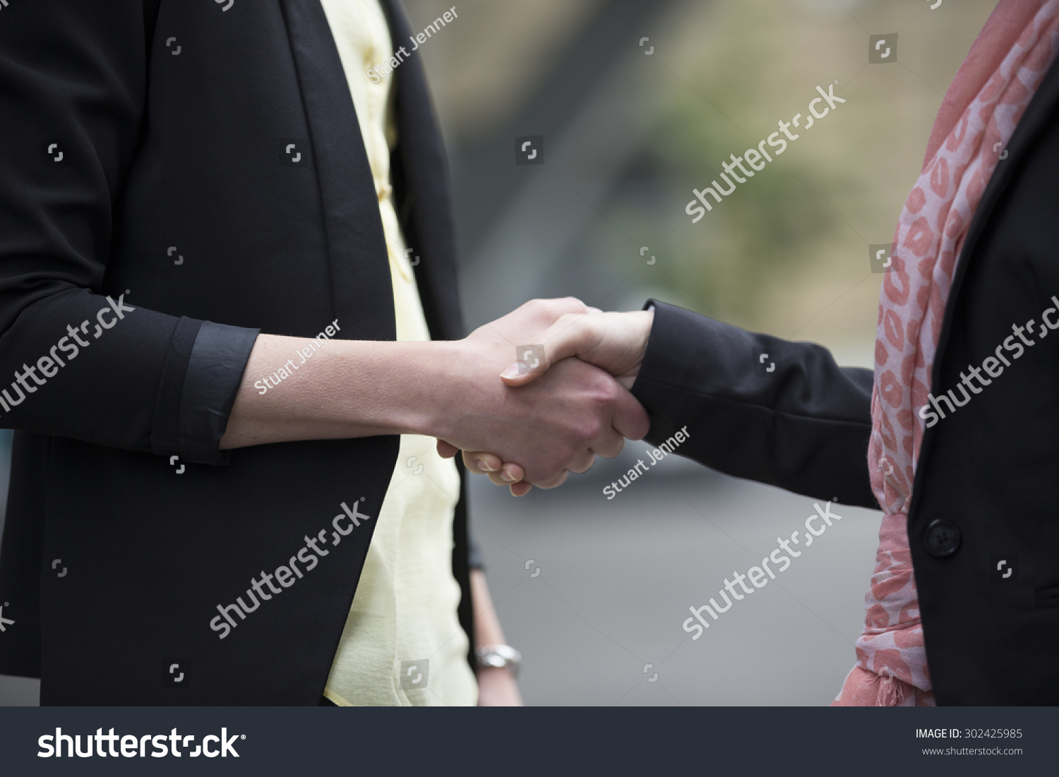 Close Up Of Two Caucasian Business Women Shaking Hands Stock Photo