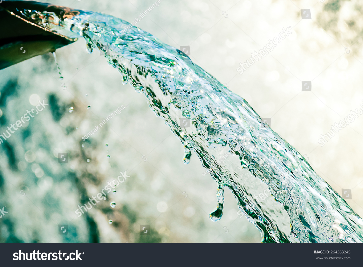 Close Up Of Water Gushing Out Of The Pipe Stock Photo 264363245