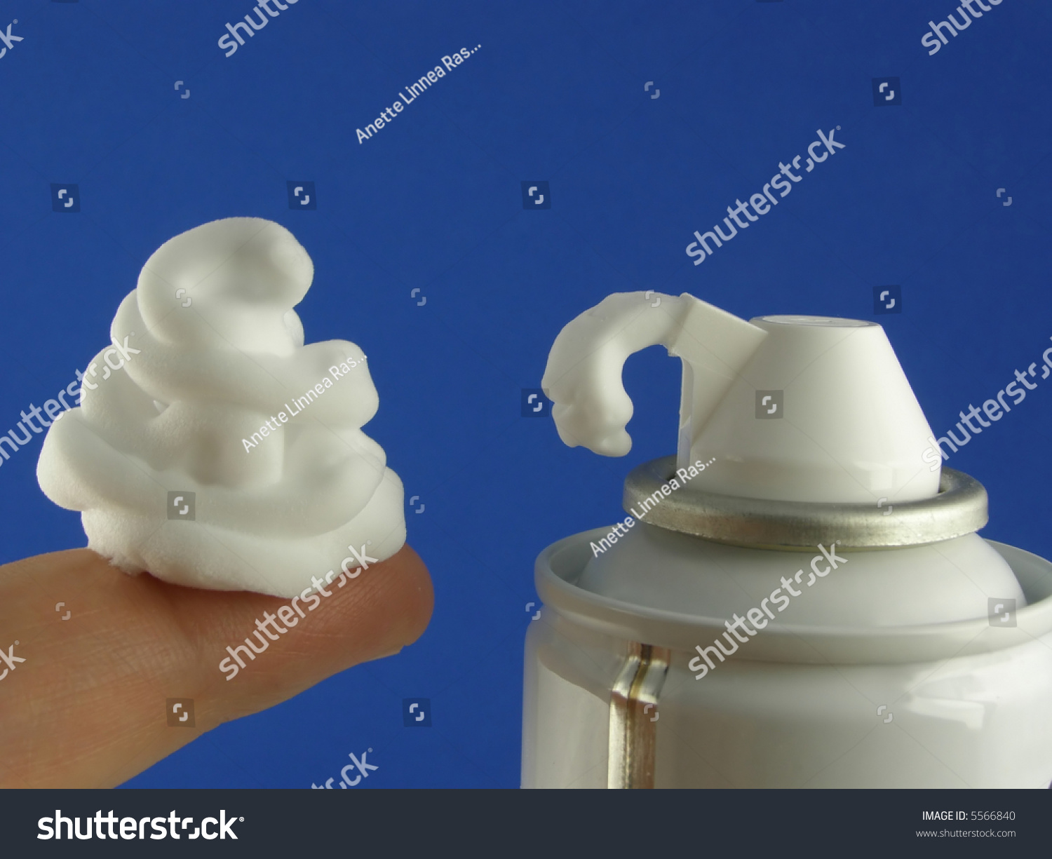 CloseUp Of White Shaving Foam On Top Of Finger Stock Photo