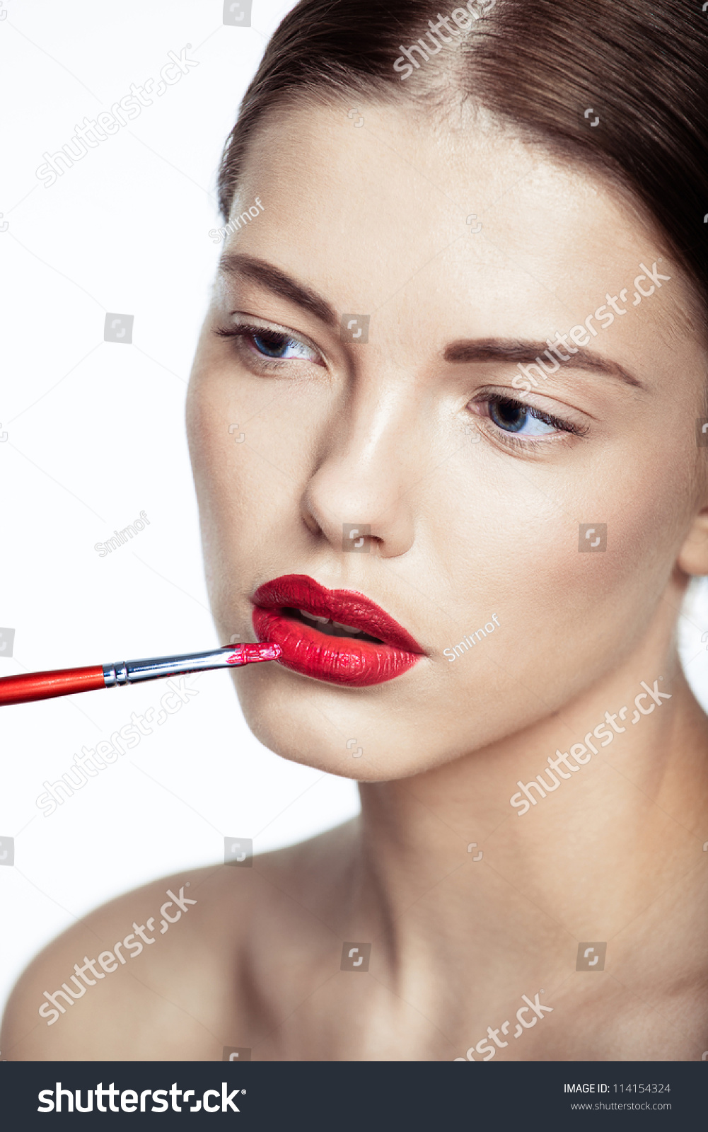 Close-Up Portrait Of Beautiful Woman Model Applying Lipstick Using Lip ...