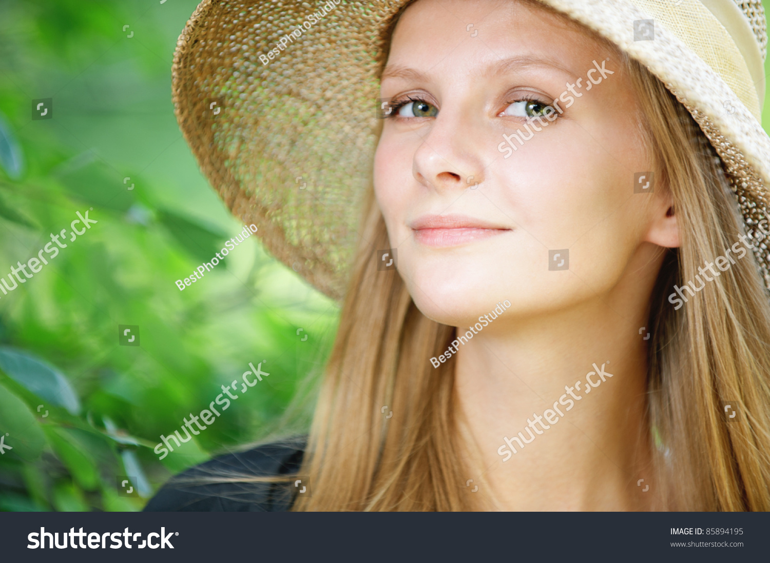 Close Up Portrait Of Young Beautiful Blonde Woman Wearing Straw Hat At