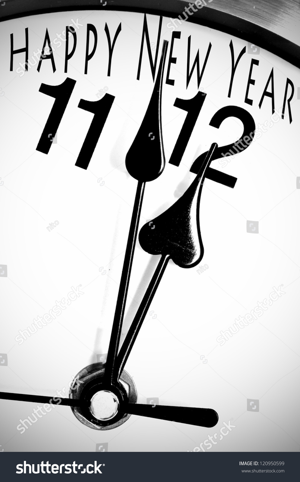 closeup of a clock minutes before midnight and sentence closeup of a clock minutes before midnight and sentence