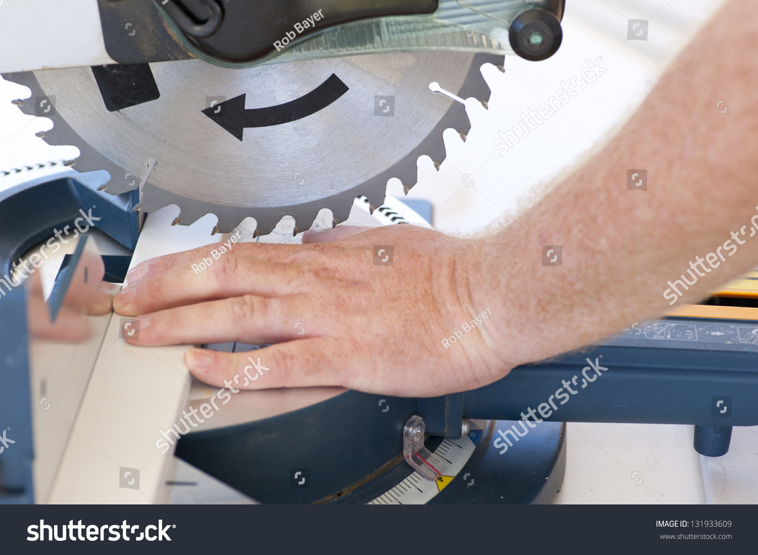 Closeup Of Sharp Circular Saw Blade And Hand Of Carpenter Or Worker, Concept Image Safety And