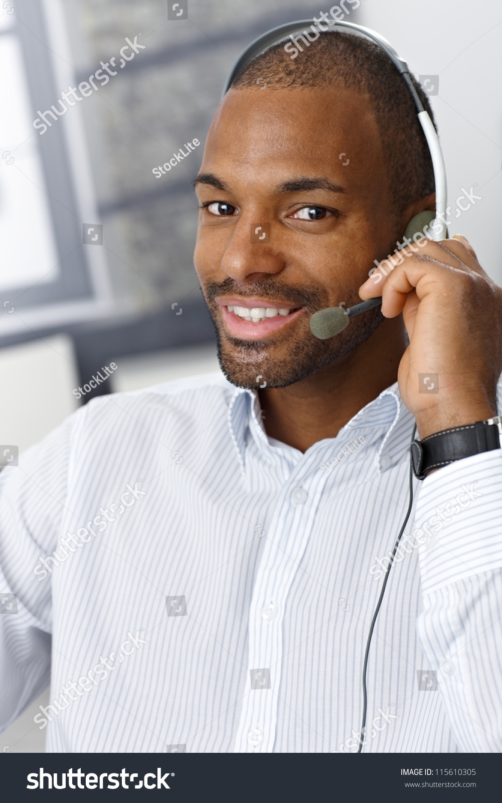 closeup-portrait-of-smiling-handsome-afro-american-customer-service