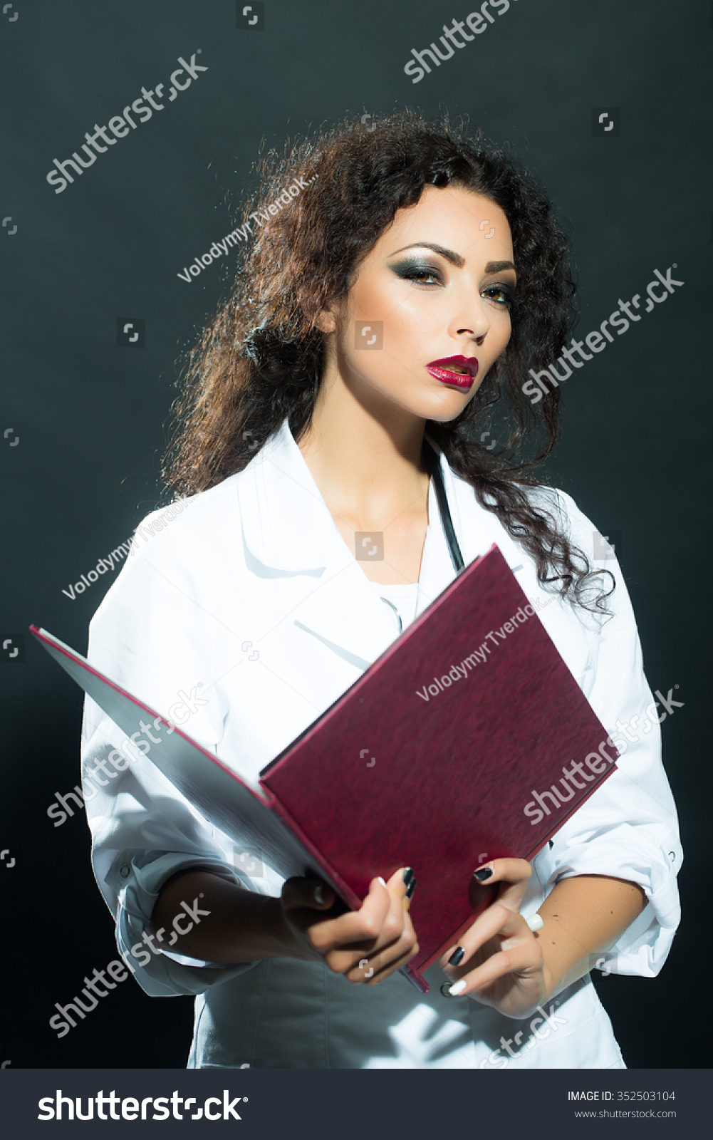 Closeup View Portrait Of One Beautiful Young Sensual Brunette Sexy Doctor With Long Curly Hair 