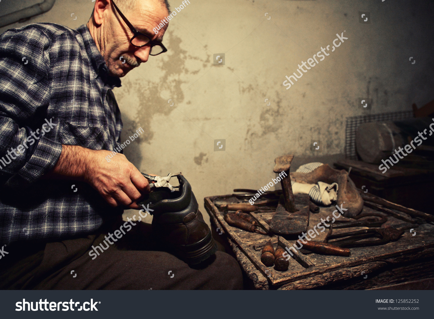 cobbler-at-work-with-old-tools-stock-photo-125852252-shutterstock