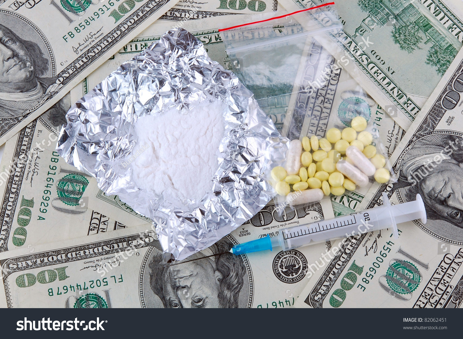 Cocaine, Tablets And Syringe On A American Dollar Bills Background ...