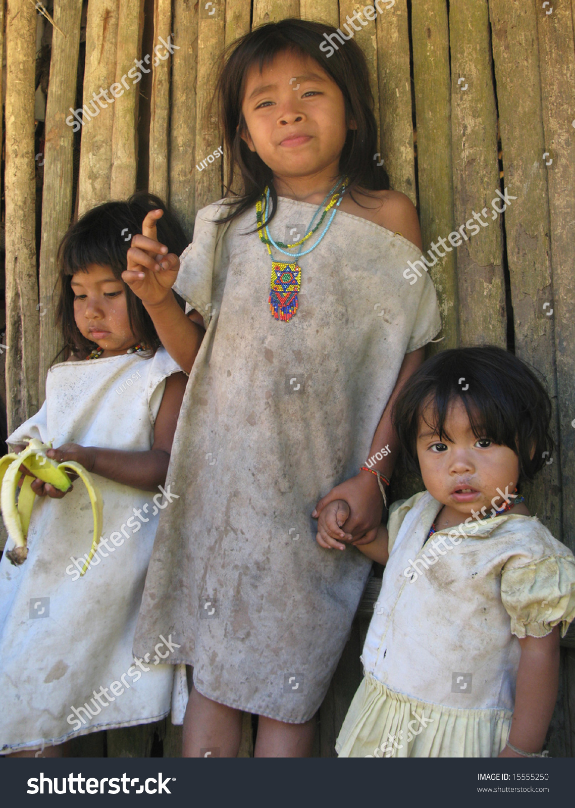 Colombia - January 28: Three Little Girls Posing In Front Of The Hut 