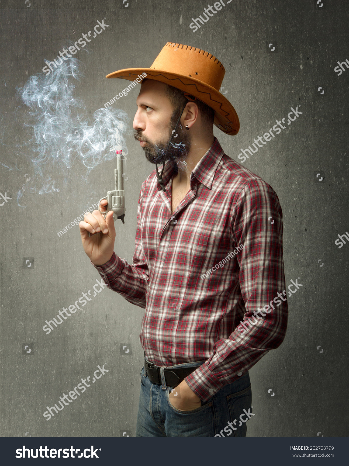 Cow Boy Blowing On Smoke Gun Stock Photo 202758799 Shutterstock