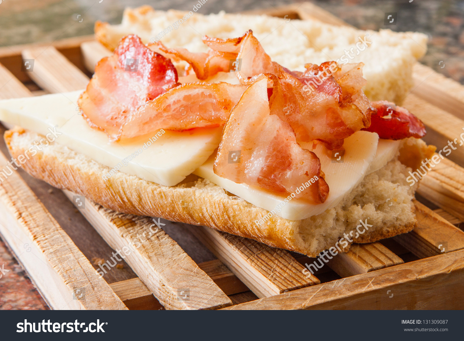 Crispy Bacon Baguette With Cheese On Wooden Table Stock Photo 131309087 ...