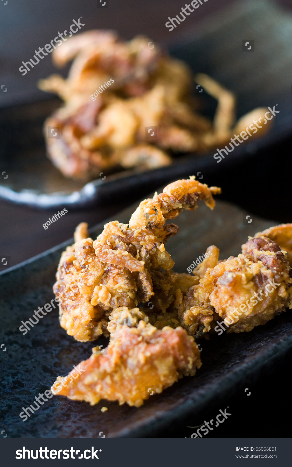 Crispy Fried Soft Shell Crab From A Japanese Menu, Served On Dark Plate