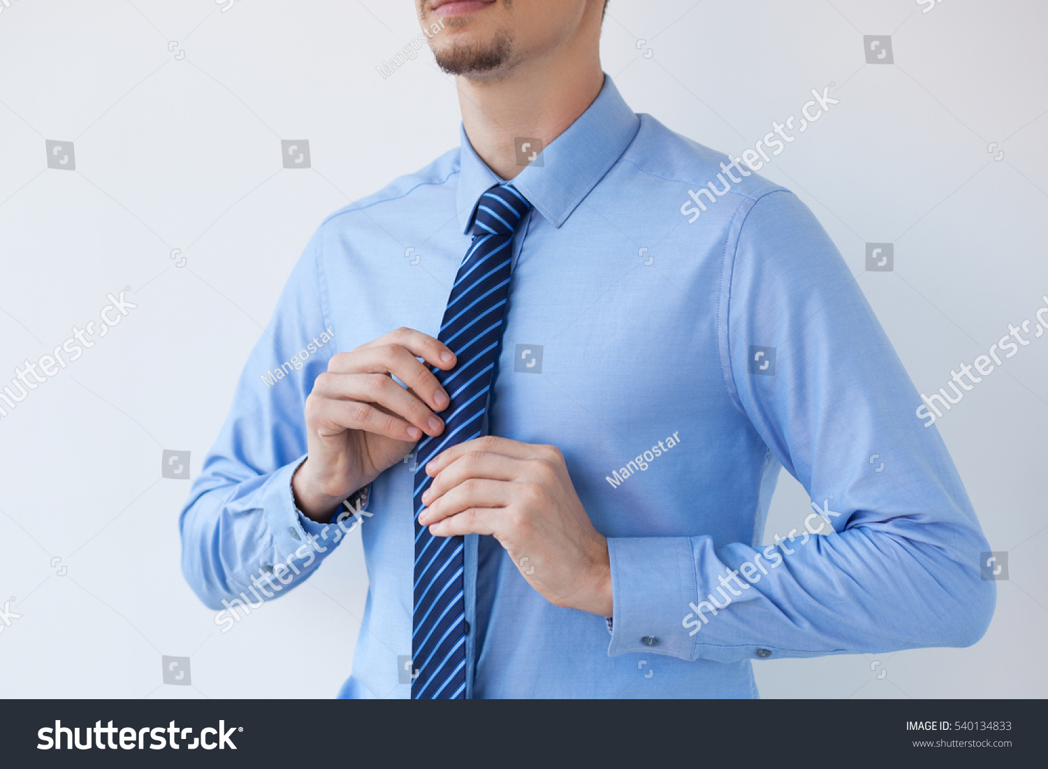 Cropped View Of Young Business Man Adjusting Tie Stock Photo 540134833 