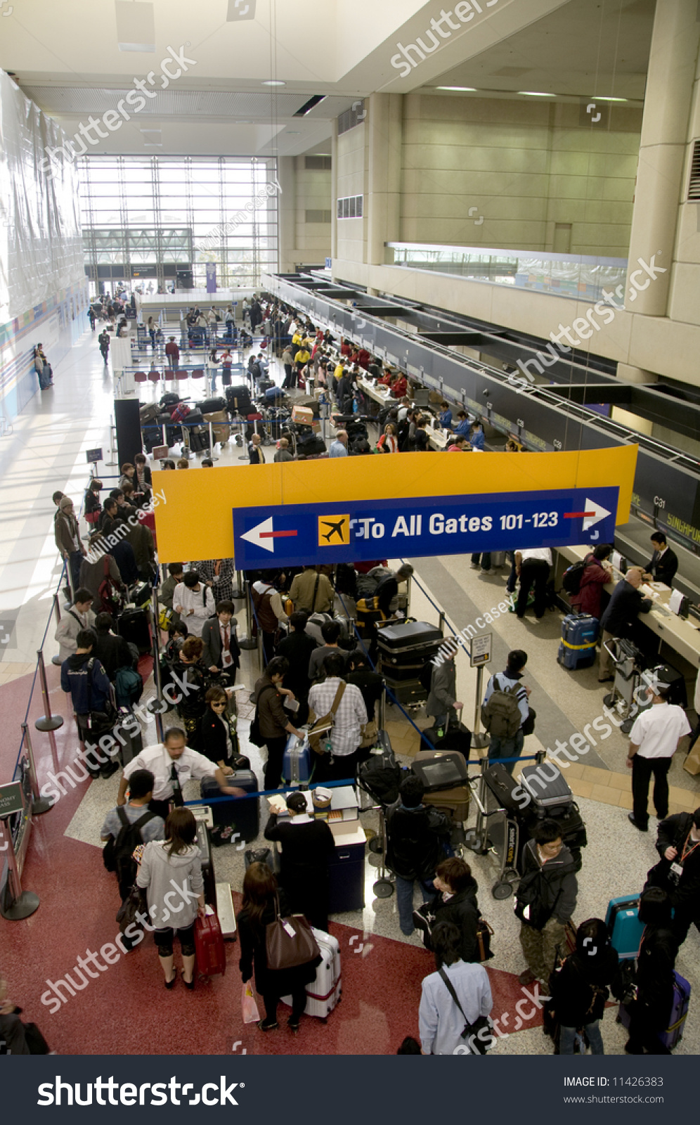 Crowds Of People Waiting In Line At An Airport Stock Photo 11426383 