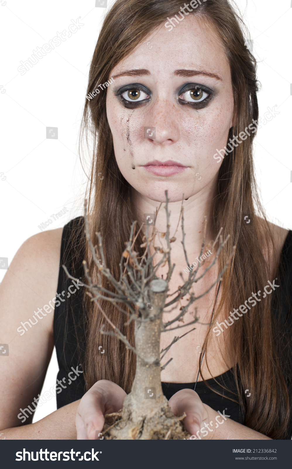 Crying woman depicting concept of dying nature holding a dead <b>bonsai tree</b>. - stock-photo-crying-woman-depicting-concept-of-dying-nature-holding-a-dead-bonsai-tree-isolated-on-white-212336842
