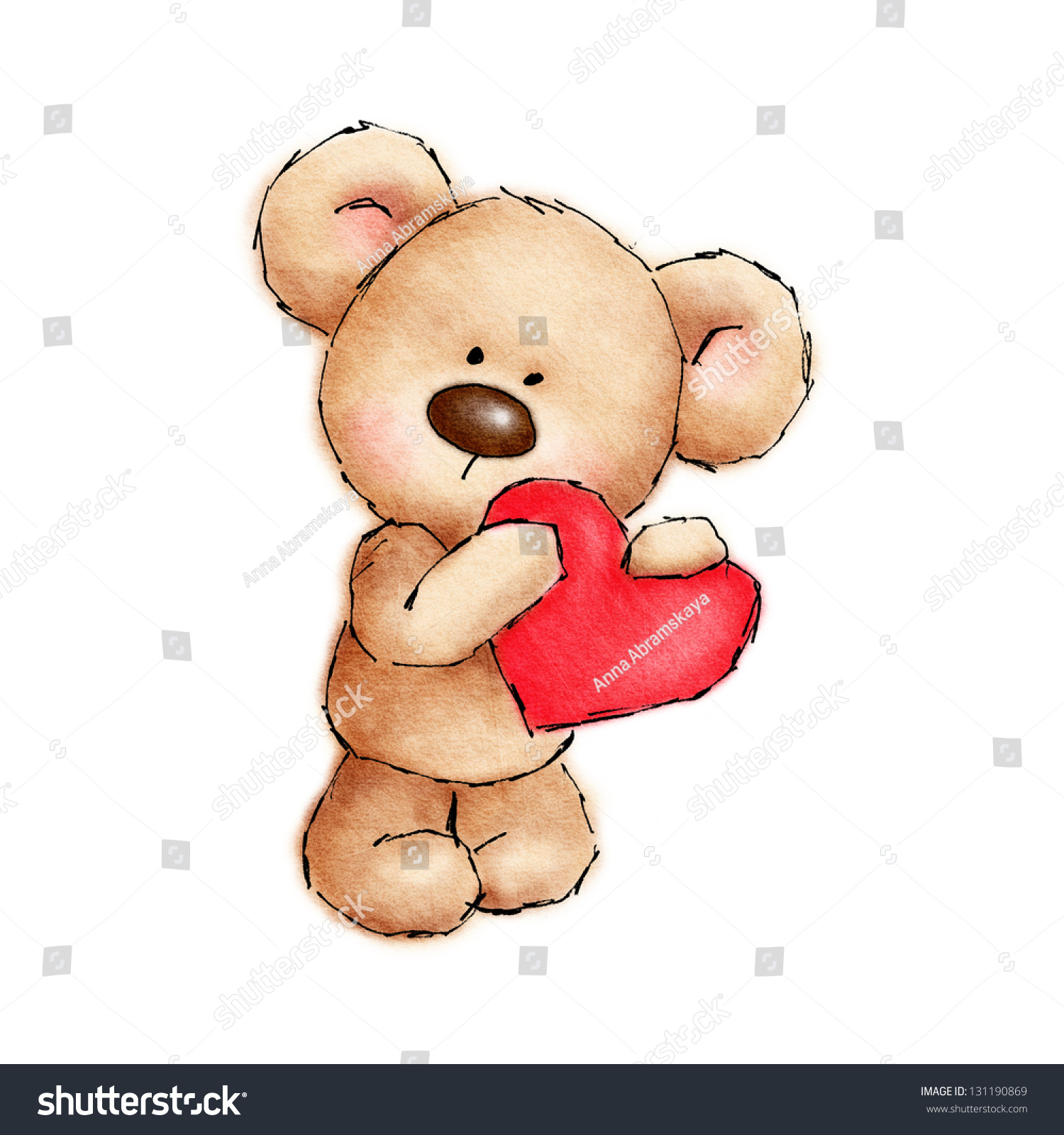 small teddy bear holding heart